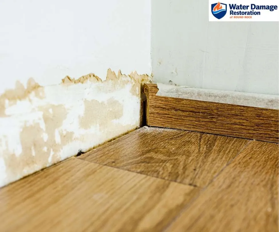 showing peeling paint and structural staining, as seen in water damage restoration